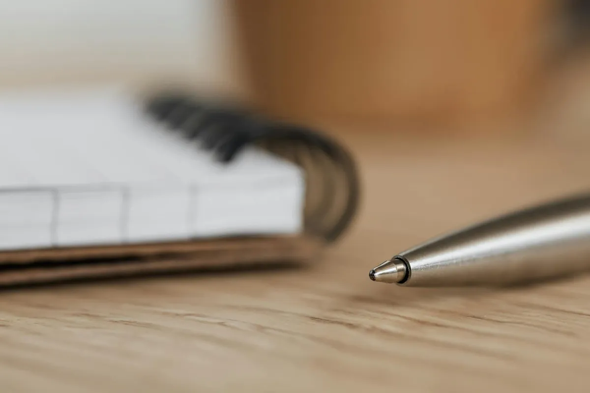 A small notebook with handwritten short passages